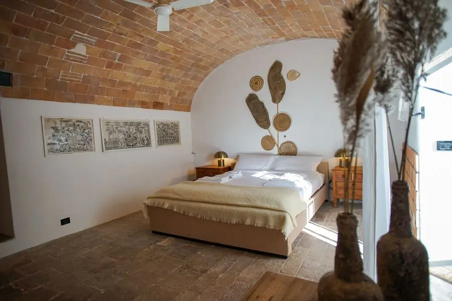 Camera Botte, a premium en-suite room with vaulted brick ceilings